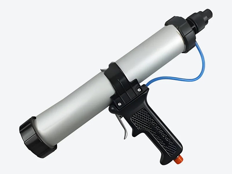 Pneumatic single-component cartridge applicator with a silver barrel, black end caps and black pistol grip with air line