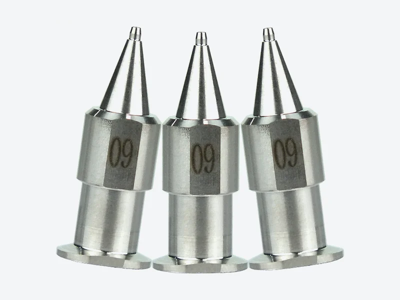 Three one-piece stainless steel bayonet-mount machine dispensing tips with conical outlets and engraved size numbers