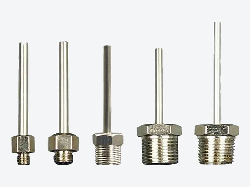 Five metal dispensing needles with externally threaded bases in increasing thread sizes