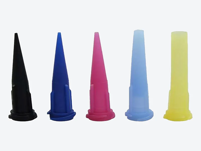 Five tapered plastic dispensing tips in black, dark blue, pink, light blue and yellow