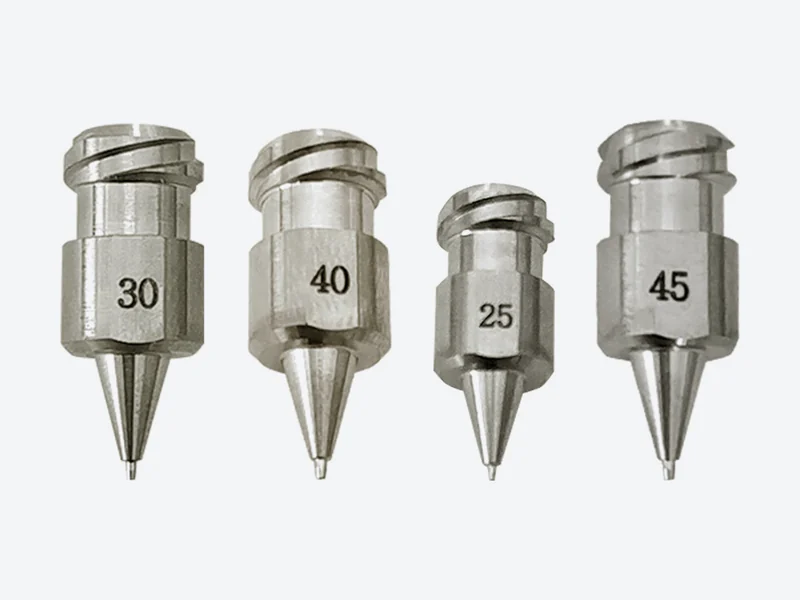 Four one-piece stainless steel threaded-mount machine dispensing tips with conical outlets and engraved size numbers